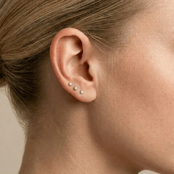 Dodatkowe przekłucie płatka ucha — Cute Piercing Warszawa